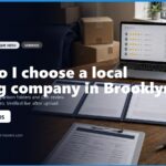 Image of a workspace featuring a laptop displaying moving company reviews, comparison folders, and checklists for selecting a local moving company in Brooklyn. The scene highlights a professional setting with a plant and moving boxes, emphasizing the theme of planning a move. Includes contact information for Brooklyn Movers.