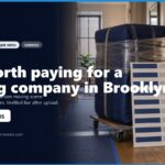 Image of a moving scene in Brooklyn, featuring wrapped furniture, boxes, and a moving dolly, illustrating the value of hiring a professional moving company. Text overlay asks if it's worth paying for moving services in Brooklyn, with contact information for inquiries.